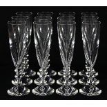 (lot of 12) Baccarat crystal champagne flutes, in the "Vega" pattern, each having a geometric tiered