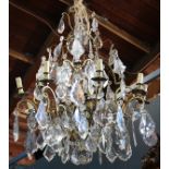 French gilt bronze and crystal chandelier, early 20th century, the tiered form having eight