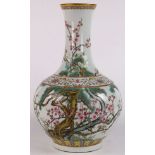 Chinese enameled porcelain vase, the trumpet neck above a globular body decorated with prunus and