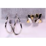 (Lot of 2) Pairs of gold hoop earrings comprised of one pair of 18k white gold carved hoop