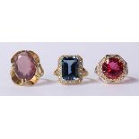 (Lot of 3) Colored stone, diamond, 14k and electroplated rings including one emerald cut blue topaz,