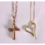 (Lot of 2) 14k yellow gold jewelry including a fluted cross, measuring approximately 1 1/2 X 5/8