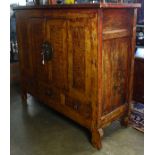 Chinese lacquered cabinet, fronted by hinged double doors, above three drawers, with metal pulls and