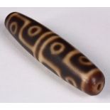 Sino-Tibetan dzi/tianzhu type bead, consisting of 12 eyes on a brown colored ground, 2.5