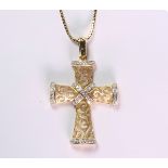 Diamond and 14k yellow gold cross pendant the featuring (56) full-cut diamonds, weighing a total