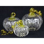 (Lot of 3) Art glass pumpkin group, each with a bulbous ridged form and a naturalistic curling