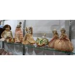 (lot of 5) Porcelain and composition half-dolls three set as pincushion; together with a