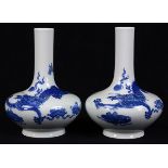 Pair of Chinese underglaze porcelain stick neck vases, the cylindrical neck above a compressed