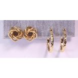 (Lot of 2) 14k yellow gold earrings including a pair of textured knot motif post earrings, measuring