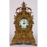 Ansonia, New York, gilt metal mantle clock, 19th century, with an urn finial, surmounting the scroll