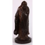 Chinese carved wood figure, featuring an elder standing on a circular plinth, 11"h; Provenance: from