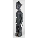 Attie/Lagoons region, Ghana tall standing male figure with tripartite coiffure , matte black