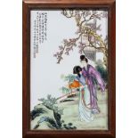 Chinese porcelain plaque, having a beauty with an attendant in the garden, with colophon to the