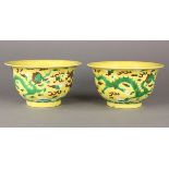 (lot of 5) Chinese famille jaune porcelain cups, each with a pair of green dragons in pursuit of a
