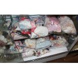 (lot of 18) Doll clothing group in assorted styles and periods; together with a doll trunk with