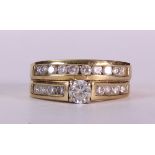 Diamond and 14k yellow gold wedding ring set centering one full-cut diamond, weighing