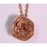 Rose gold rose pendant-necklace featuring one 14k rose gold mesh rose, set in a rose gold pendant