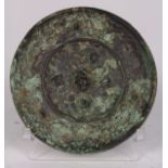 Chinese bronze mirror, the back with recumbent beasts to the center, surrounded with birds and grape