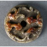 Chinese archaistic jade bi-disc, carved with a pair of meandering chilong, reversed with scroll