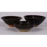 (lot of 3) Chinese dark glazed ceramic bowls, one featuring a pair of zoomorphs to the interior,