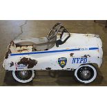 NYPD Gearbox Pedal Car, executed in white with chrome accents, 19.5"h x 33"l