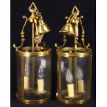 Pair of brass foyer lights, early 20th Century, the cylindrical form with inset glass panels,