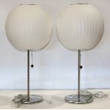 Pair of Modern George Nelson for Modernica bubble table lamps, each having a spherical shade above