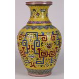 Chinese enameled large porcelain vase, with lotus and scrolls on a yellow scrafito ground, base with