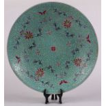 Chinese enameled porcelain charger, with butterflies, flowres and shuangxi characters on a turquoise