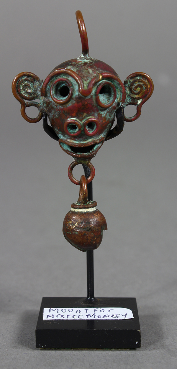 Pre-Columbian bell in the form of a monkey's head executed in copper with some tubaga gold, circa AD