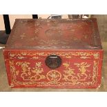 Chinese gilt lacquered leather trunk, the hinged lid featuring gilt bats and floral roundels on a