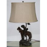 Patinated metal figural lamp, the standard depicting a rider on horseback, 24"h