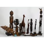 (lot of 12) West African decorative carvings including dolls, female figures, and a stylized