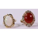 (Lot of 2) Multi-stone and gold rings including one ring featuring (1) oval opal, measuring