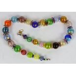 Italian Murano art glass beaded necklace, having polychrome glass beads flecked gold, spiral