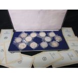 A cased set of 12 Sterling Silver Epic of Napoleon medallions