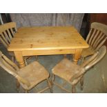 A vintage pine table and 4 chairs