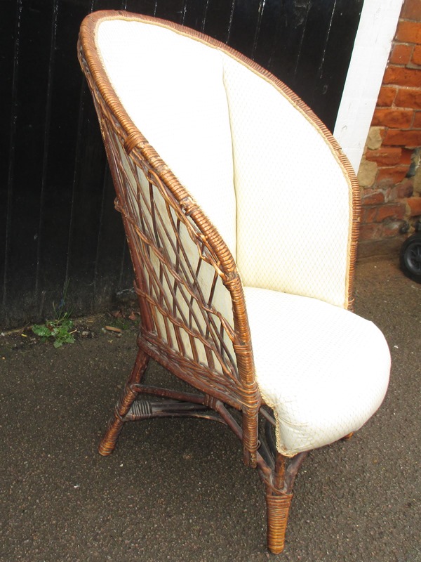 A upholstered wicker chair