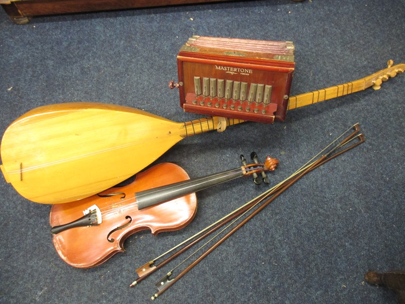 A German squeeze box, Violin & Two bows and a Sitar
