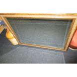 A large bevelled glass wall mirror 91x115cm