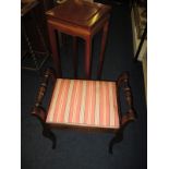 An upholstered piano stool and a Jardinière stand