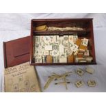 An early 20th century bone and bamboo Mah Jong set