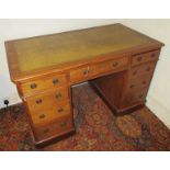 A 19th century 9 drawer pedestal desk with leather top