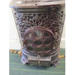 A vintage continental cast iron room heater
