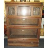 An oak Globe Wernicke bookcase with lower drawer unit and upper cupboard unit