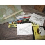 A boxed train set, puzzles and a model plane