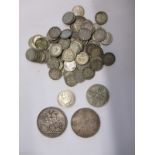 A quantity of silver coins to include an 1882 crown and an 1887 Double Florin