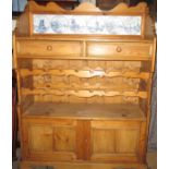 A pine two drawer dresser with bottle rack