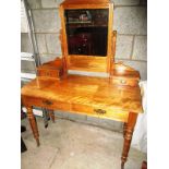 An early 20th century Satinwood dressing table with central mirror