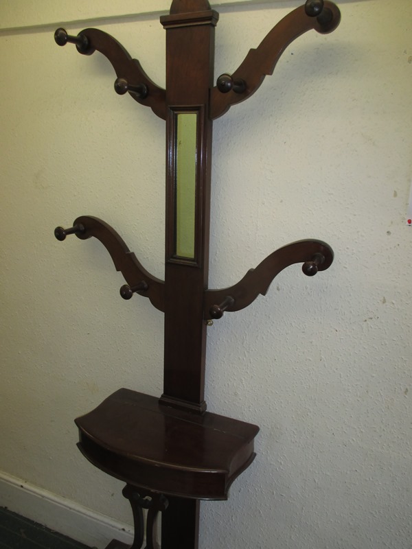 An Edwardian mahogany hall stand with glove box and umbrella stand